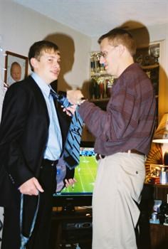 Bob helping Matt with his tie before a school dance.