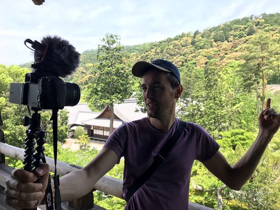 Janos recording one of his travel vlogs while in Kyoto, Japan
