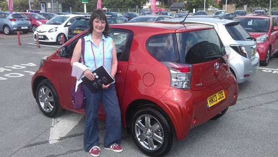 So proud of her brand new little Toyota iQ