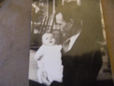 Charlotte as a baby with her father