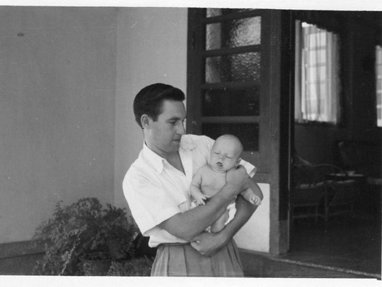 Peter and his first born in Singapore