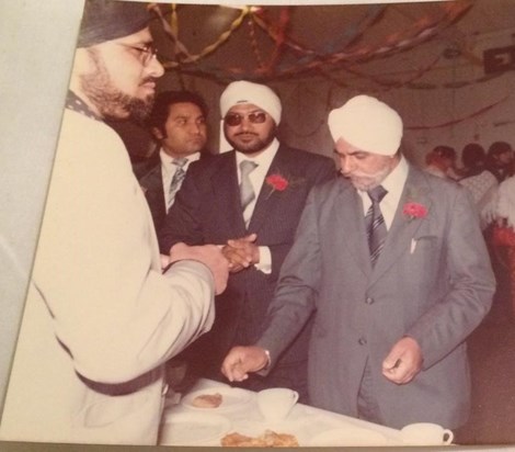 Having samosas and tea with father inlaw at Daffu wedding in 1980