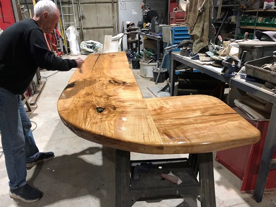 Dad helping me finish off the bar top for our summer kitchen. Dad was always ready to help me whenever I needed him. 