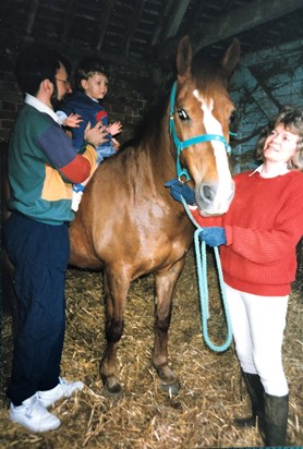 With her beloved horse Cinders