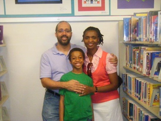 Danai, mum and dad.  His art work displayed at the durham county library.  So proud of my baby.
