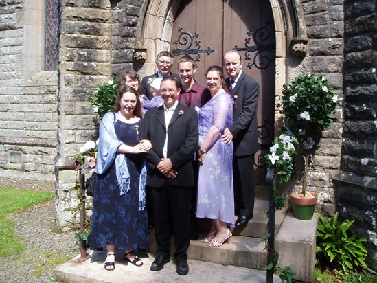 P1010021 The family scrubbed up well for a wedding 16.7.2025. Who's the little one being held by Grandma?