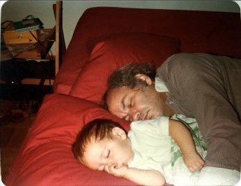 Marty sleeping with his newborn son
