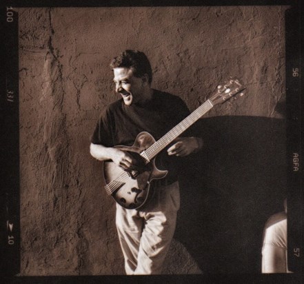 Karl laughing with guitar, Park Slope, Brooklyn, ca. 1997