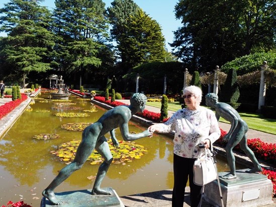 2020 - Val in Compton Acres, shaking hands with an Italian athlete in the Italian Garden
