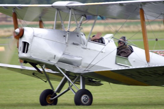 John waving on take off for a flight in a Sopwith Camel, 25 July 2004
