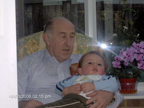 Dennis with his grandson Ewen as a baby taken in Phil and Ken's conservatory in 2006
