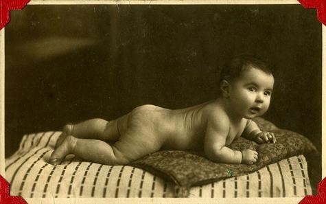 At 4 months. Very few early photos survived, as most were destroyed during  WW2