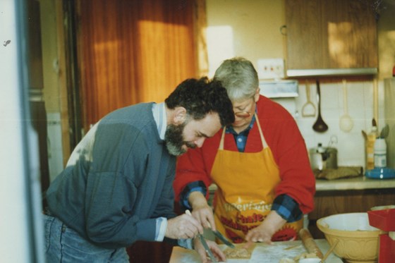 Peter teaching Mary to cook