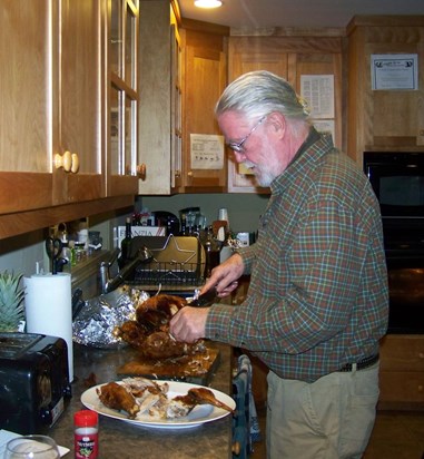 Bwana cutting his famous deep fried turkey in his son Wayne's kitchen!!