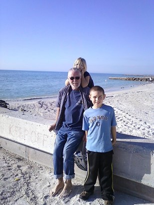 Bwana w/two of his grandkids, Sam & Addie enjoying a beach in Florida, Christmas 2010.