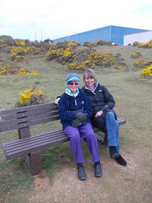 Shirley and Clare at Dad's bench at Sizewell.