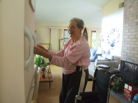 Anne learning to stand again in living room