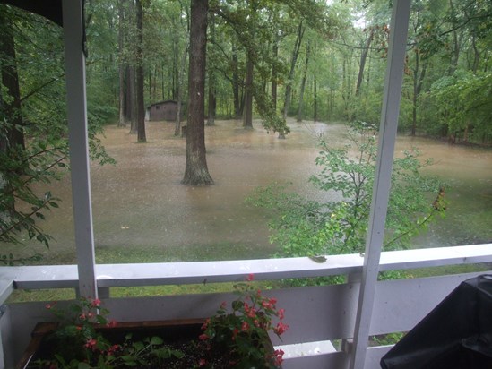 Floodwaters come up to 10' of home in backyard