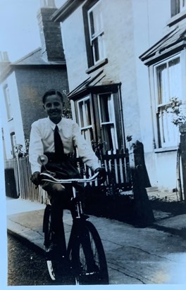 John on his bike as a teenager