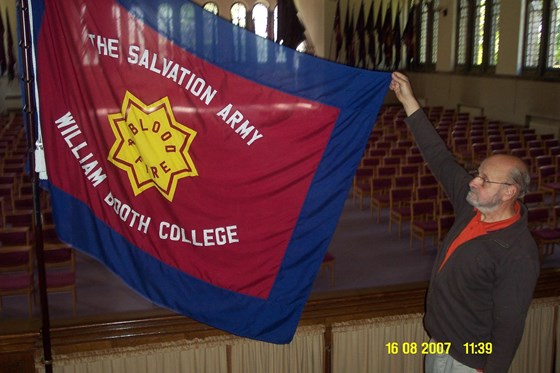 John holding flag on Salvation Army Training College