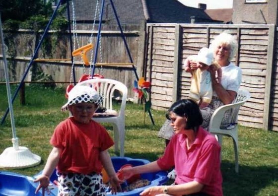 Mum playing with the grandchildren at Mandys Summer 1996