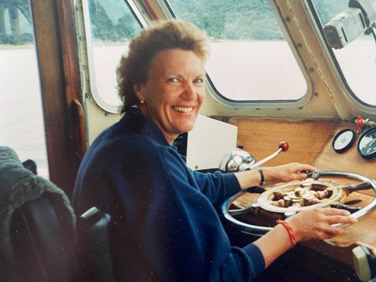 Mum driving a boat