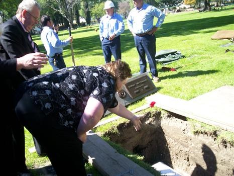 Chrissy Tosses A Rose On Haskell's Grave