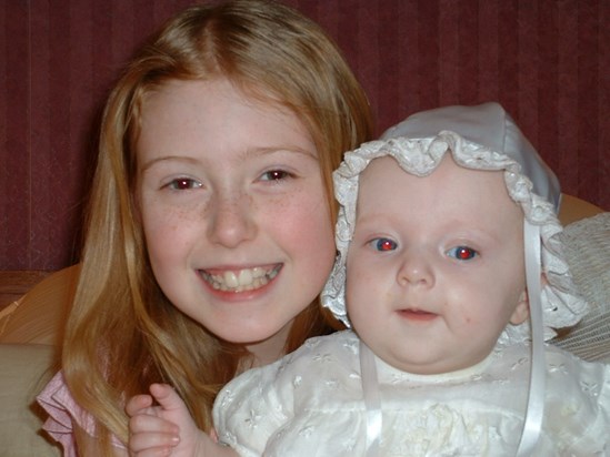 orla and her big sis on her christening day