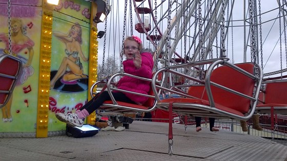 orla loved this swing at the fairground and went on it over and over