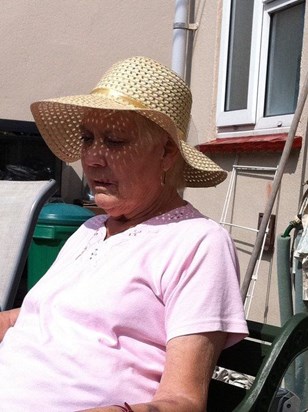 she loved to sit in her garden in the sun surrounded by family!