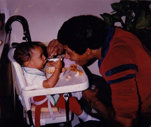 Victor feeding baby Carmel