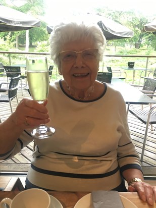 Always happy with a glass of fizz in her hand!