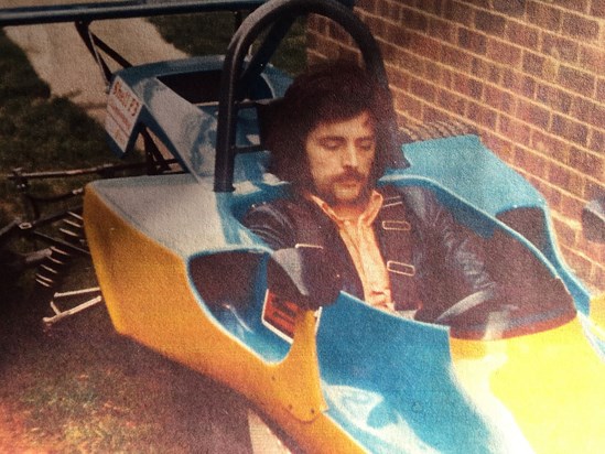 Dad in his beloved racing car. 
