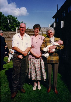 Kenneth, Julie & Marion holding baby