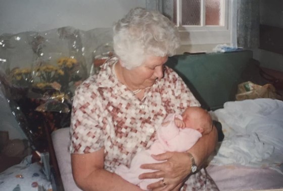 Grandma holding me as a baby