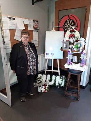 susan with your funeral flowers at your wake 