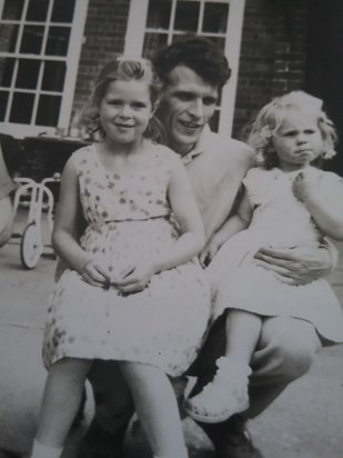 Dad with his girls. Happy childhood memories.