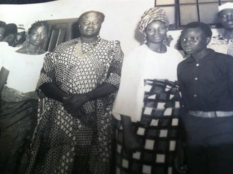 Young Tunde with his parents and elder sister