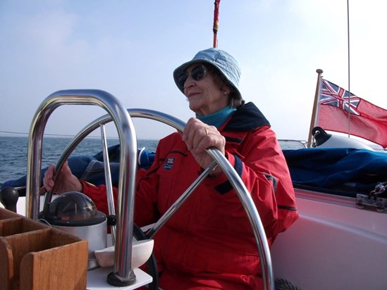 Joy helming Country Girl in her RNLI Jacket