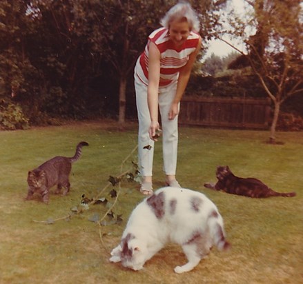Peggy and 3 of the cats in her life