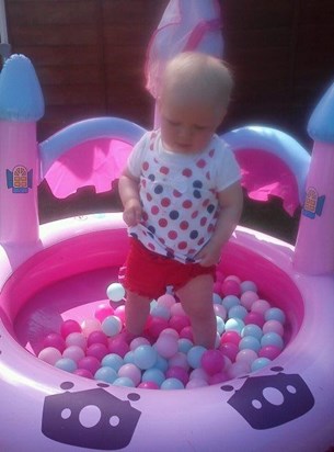 playing in her pink pretty princess ballpit