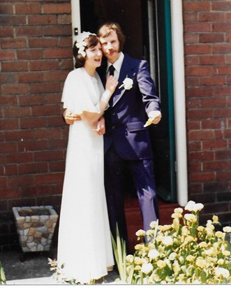 our wedding day at the front door of my parents house 