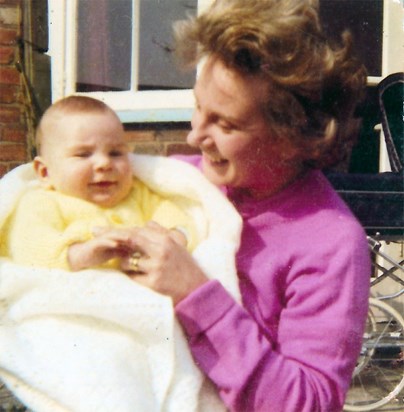 Peggy with baby son Jonathan in the garden at home