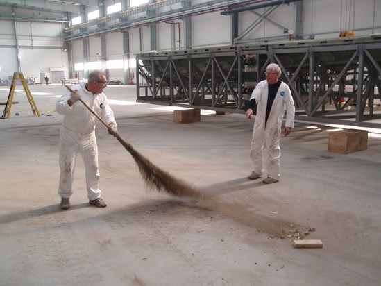 Inside TPI's first China plant in 2008.  Roger directing Julio in proper use of locally supplied broom.