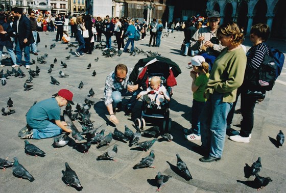 On holiday with the gang, feeding pigeons in Venice