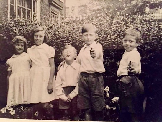 Colin with his brother and his cousins. X