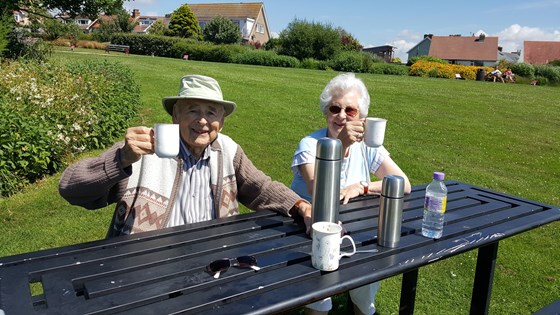 Dad and Mum in the park enjoying a cup of coffee!