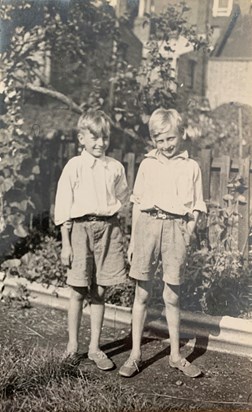 Dad and his twin brother Ray in the garden of Knapp Road, Bow. 