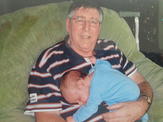 Liam snuggling with Grandad