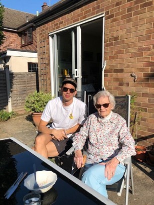 Ollie sunbathing with granny 